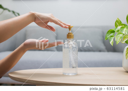 Bangkok / Thailand - March 08 2020 : Closeup of women hand using alcohol gel disinfecting hands Bangkok / Thailand - March 08 2020 : Closeup of women hand using alcohol gel disinfecting hands 63114581