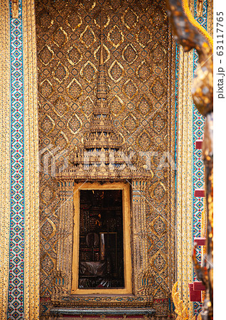 Golden carved wood Thai window of Bangkok Grand palace Golden carved wood Thai window of Bangkok Grand palace 63117765