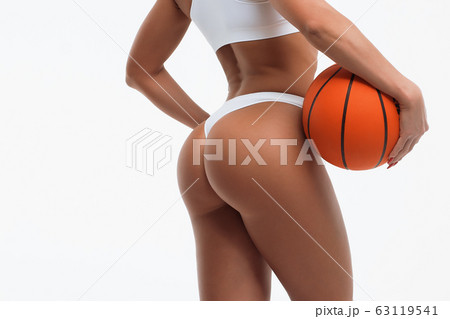 Sporty woman with basketball ball Sporty woman with basketball ball 63119541