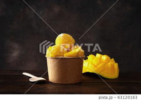 A paper cup with delicious vegan tropical sorbet A paper cup with delicious vegan tropical sorbet 63120163