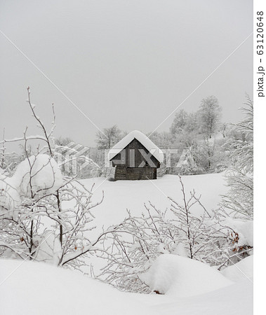 Minimalistic winter landscape with wooden house Minimalistic winter landscape with wooden house 63120648