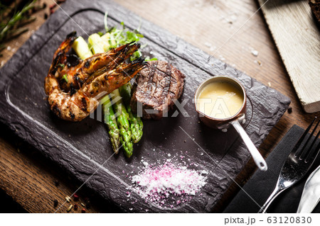 Tasting menu. Beef steak and grilled tiger prawns. 63120830