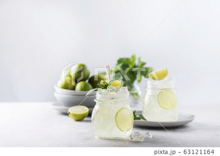 Mojito cocktail with lime Mojito cocktail with lime 63121164