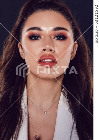 Portrait of a sexy young woman with beautiful makeup and shiny lips. 63121592