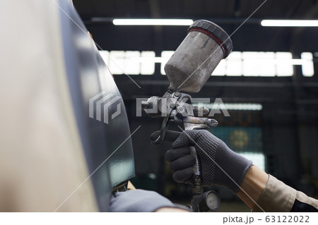 Hand With Spray-gun Painting Car 63122022