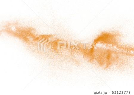 Orange powder dust particles explosion on white  63123773