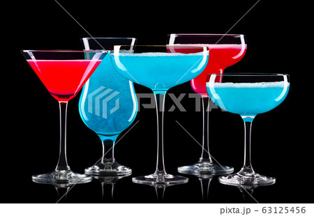 Set of different cocktail glasses for drinks on black background 63125456