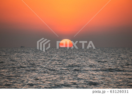 Sundown Above Sea Horizon At Sunset. Natural Sunrise Sky Warm Colors Over Ocean Sundown Above Sea Horizon At Sunset. Natural Sunrise Sky Warm Colors Over Ocean 63126031