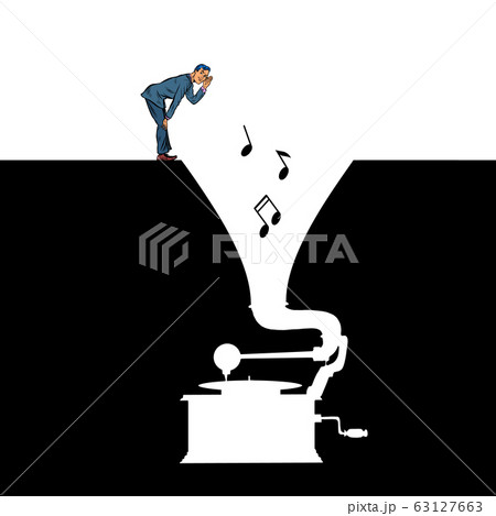 Music. A man listens to an old vinyl gramophone 63127663