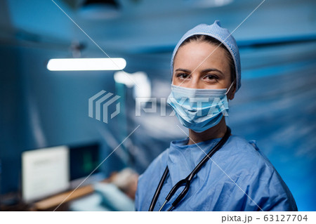 Doctor in hospital looking at camera, coronavirus concept. 63127704