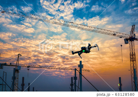 Drone over construction site. video surveillance Drone over construction site. video surveillance 63128580