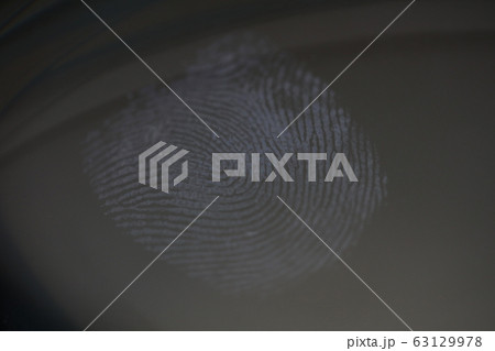 Fingerprint mark on clear glass as crime evidence Fingerprint mark on clear glass as crime evidence 63129978