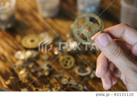 Female master works in her workshop. Female master works in her workshop. 63131110