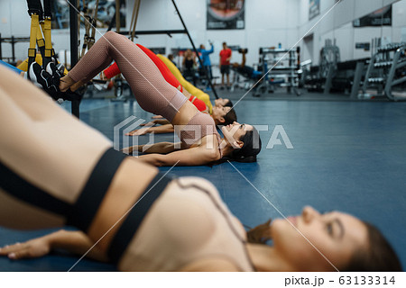 Group of women doing press exercise in gym Group of women doing press exercise in gym 63133314