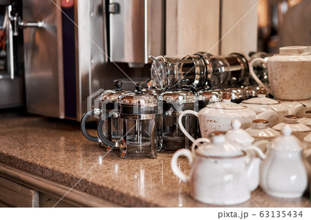 Group of empty cups and teapots in many rows. Tableware for coffee and tea in breakfast and seminar event. 63135434