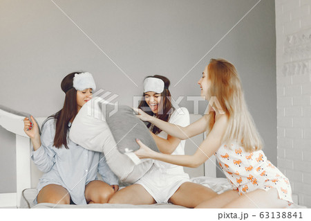 Three girls have pajamas party at home 63138841