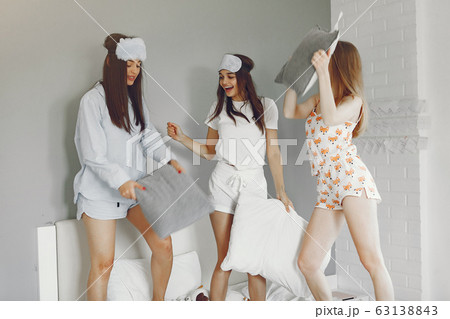 Three girls have pajamas party at home Three girls have pajamas party at home 63138843