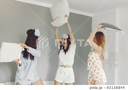 Three girls have pajamas party at home 63138844