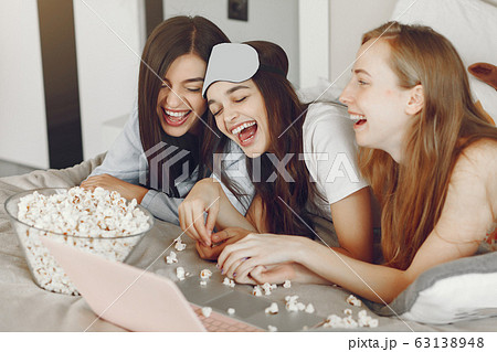 Three girls have pajamas party at home 63138948