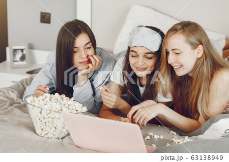 Three girls have pajamas party at home 63138949
