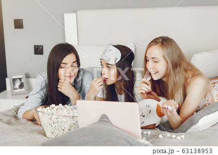 Three girls have pajamas party at home 63138953