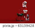 クリスマスのコスチュームを着てプレゼントの袋の隣でポーズをとる笑顔の日本人の若い女性と犬 63139428