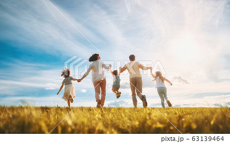 Happy family on summer walk Happy family on summer walk 63139464