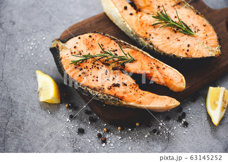 Grilled salmon steak with herbs and spices 63145252