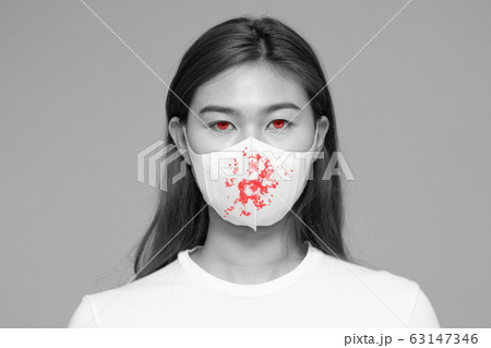 virus infection woman waring protection mask with blood on mask virus infection woman waring protection mask with blood on mask 63147346