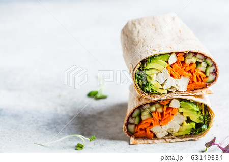 Vegan tortilla wraps with tofu, cucumber, carrots 63149334