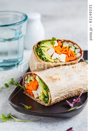 Vegan tortilla wraps with tofu, cucumber, carrots 63149335