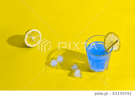 Blue cocktail on yellow background. Summer concept. 63150742