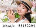 beautiful girl and cherry blossom 63152294