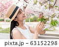 beautiful girl and cherry blossom 63152298