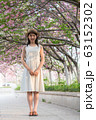 beautiful girl and cherry blossom 63152302