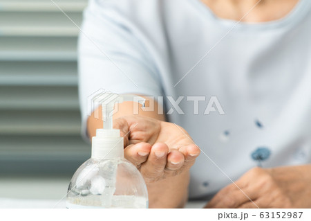 Senior hand apply alcohol gel or anti bacteria soap to make cleaning and clear virus, germ, bacteria Senior hand apply alcohol gel or anti bacteria soap to make cleaning and clear virus, germ, bacteria 63152987