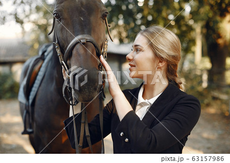 The rider in black form trains with the horse 63157986