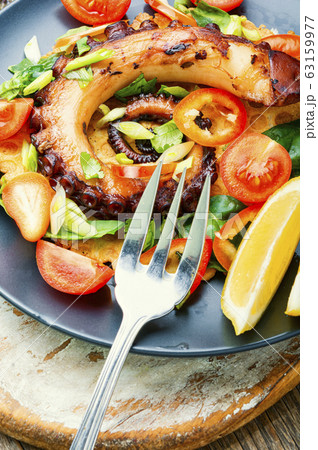 Vegetable salad with octopus. 63159977
