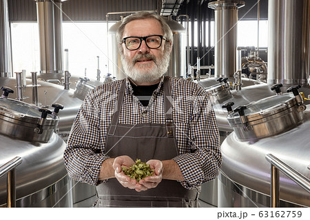 Professional brewer on his own craft alcohol production Professional brewer on his own craft alcohol production 63162759