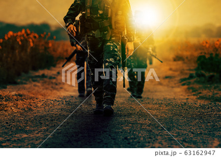 soldier with long rifle gun walking on dirt battle soldier with long rifle gun walking on dirt battle 63162947