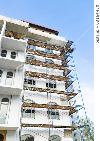 Extensive scaffolding for building a new house. 63164450