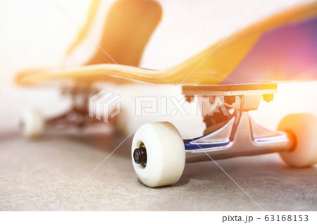 Close up of a skate board at sunset at the skate park. Close up of a skate board at sunset at the skate park. 63168153