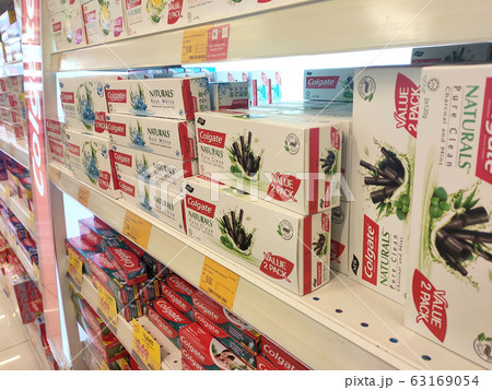 The toothpaste is in the box and is displayed on the shelf sorted by brand and type. This makes it easy for buyers to choose from. 63169054