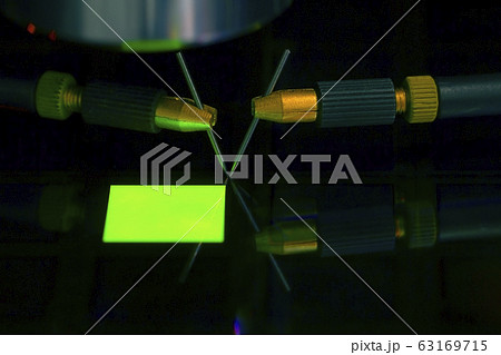 Close up of examining a sample of OLED display Close up of examining a sample of OLED display 63169715