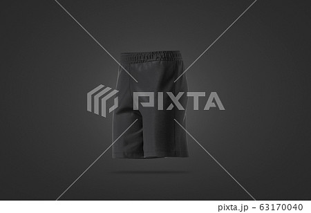 Blank black soccer shorts mock up on dark background 63170040