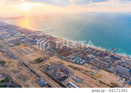 Aerial view of petrochemical oil refinery and sea Aerial view of petrochemical oil refinery and sea 63171301