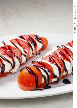 tomatoes with mozzarella and balsamic cream tomatoes with mozzarella and balsamic cream 63172048