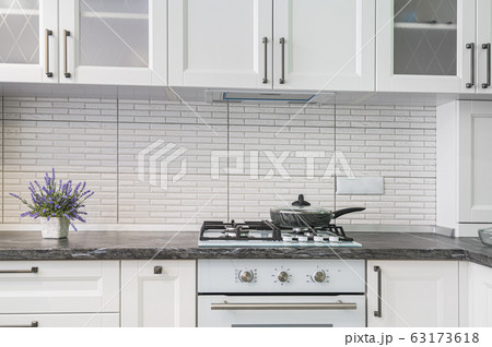 Modern white kitchen interior, front view 63173618