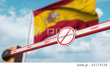 Barrier gate with STOP CORONAVIRUS sign being closed with flag of Spain as a background. Spanish quarantine. 3D rendering Barrier gate with STOP CORONAVIRUS sign being closed with flag of Spain as a background. Spanish quarantine. 3D rendering 63174238