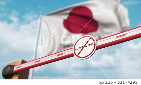 Barrier gate with STOP CORONAVIRUS sign being closed with flag of Japan as a background. Japanese quarantine. 3D rendering Barrier gate with STOP CORONAVIRUS sign being closed with flag of Japan as a background. Japanese quarantine. 3D rendering 63174295